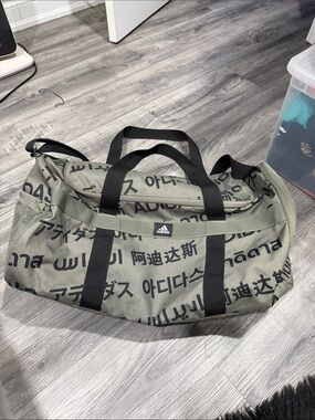 adidas Olive Green Duffel with Black Straps and Multilingual Print